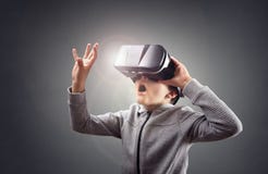 Boy experiencing using a virtual reality headset Royalty Free Stock Image Boy experiencing using a virtual reality headset Royalty Free Stock Image