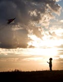 Boy Flies Kite. Royalty Free Stock Photo