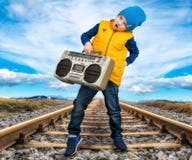 The boy listened to vintage tape recorder.Vintage style .Children`s fashion. royalty free stock images The boy listened to vintage tape recorder.Vintage style .Children`s fashion. royalty free stock images