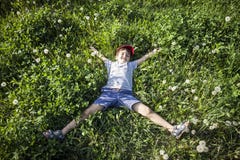 Boy Lying On The Grass Royalty Free Stock Photos Boy Lying On The Grass Royalty Free Stock Photos