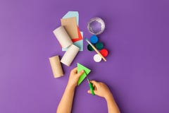 Boy Makes Halloween Toys From Paper. Toilet Roll Tube By Hands. Creative DIY For Kids On Traditional Purple Backgrpund. Home Decor Royalty Free Stock Photos Boy Makes Halloween Toys From Paper. Toilet Roll Tube By Hands. Creative DIY For Kids On Traditional Purple Backgrpund. Home Decor Royalty Free Stock Photos