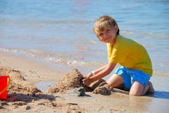 Boy Playing On The Beach Royalty Free Stock Images Boy Playing On The Beach Royalty Free Stock Images