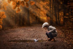 Boy Playing With The Paper Boat Royalty Free Stock Image Boy Playing With The Paper Boat Royalty Free Stock Image