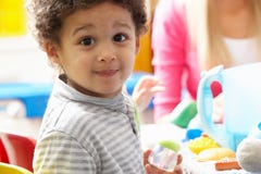 Boy Playing With Toys In Nursery Royalty Free Stock Photo