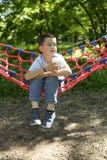Boy in a hammock with a paper Cup of drink Stock Photography Boy in a hammock with a paper Cup of drink Stock Photography
