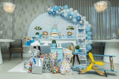 Boy`s birthday party with bluish pastel colors decoration