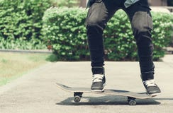 Boy skater is doing stunt at the street stock images Boy skater is doing stunt at the street stock images