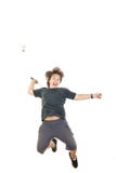 Boy smiling and holding badminton racket and trying to hit ball Royalty Free Stock Image Boy smiling and holding badminton racket and trying to hit ball Royalty Free Stock Image
