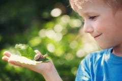 Boy and snail Royalty Free Stock Photos Boy and snail Royalty Free Stock Photos
