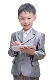 Boy in suit using tablet computer stock images Boy in suit using tablet computer stock images