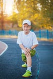 Boy Teen doing sports exercises on a stadium stock photo Boy Teen doing sports exercises on a stadium stock photo