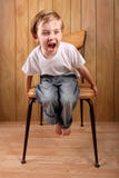 Boy throwing a tantrum while on a time out Stock Photography Boy throwing a tantrum while on a time out Stock Photography