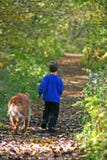 Boy walking with dog