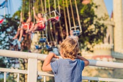 The boy wants to ride on the merry-go-round royalty free stock image The boy wants to ride on the merry-go-round royalty free stock image