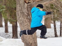 Boy in Winter Park jumps into the snowdrift stock photo Boy in Winter Park jumps into the snowdrift stock photo