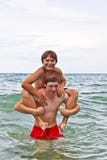 Boys Having Fun In The Beautiful Clear Sea Stock Photography