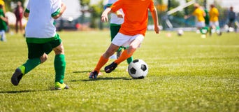 Boys Kicking Soccer Ball. Children Soccer Team. Running soccer players stock image Boys Kicking Soccer Ball. Children Soccer Team. Running soccer players stock image