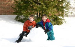 Boys Playing In The Snow Stock Photo