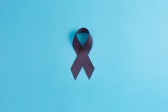 Brain cancer grey color awareness ribbon isolated on blue background royalty free stock image Brain cancer grey color awareness ribbon isolated on blue background royalty free stock image