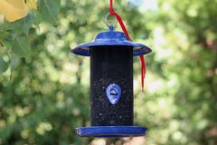 Brand New Blue Bird Feeder Royalty Free Stock Images
