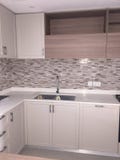 Brand New White Kitchen Counter with sink . View of cabinets and storage royalty free stock photos Brand New White Kitchen Counter with sink . View of cabinets and storage royalty free stock photos