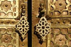 Brass gate with doorknockers. Marrakech, Morocco
