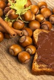 Bread with chocolate cream and hazelnuts on table Royalty Free Stock Images Bread with chocolate cream and hazelnuts on table Royalty Free Stock Images