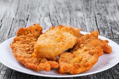 Bread crumb chicken chop on white dish. closeup stock photo Bread crumb chicken chop on white dish. closeup stock photo