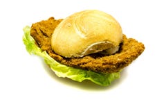 Breaded schnitzel in bun with salad isolated on white background royalty free stock image Breaded schnitzel in bun with salad isolated on white background royalty free stock image