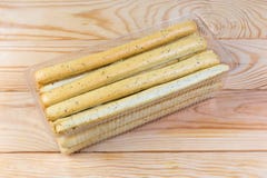 Breadsticks with Italian herbs in container on a rustic table stock photos Breadsticks with Italian herbs in container on a rustic table stock photos