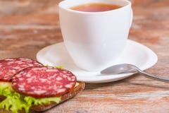 Breakfast With Salami Sandwich And Cup Of Tea Stock Photography