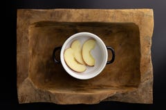 Breakfast on a wooden rectangular bowl with a black and white pot. stock photo Breakfast on a wooden rectangular bowl with a black and white pot. stock photo