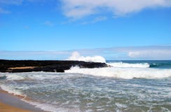 Breaking Waves Against Black Lava on Kauai stock photo Breaking Waves Against Black Lava on Kauai stock photo