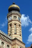 Brick exterior detail of synagogue with clock tower and onion dome stock image Brick exterior detail of synagogue with clock tower and onion dome stock image