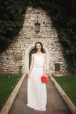 Bride. Beautiful young woman in the park with bouquet on a warm summer day. royalty free stock image Bride. Beautiful young woman in the park with bouquet on a warm summer day. royalty free stock image