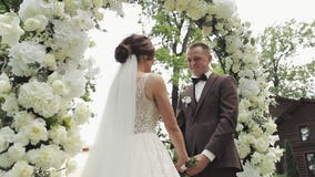 Bride And Groom Holding Hands For Their Wedding Vows Bride Saying