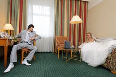 Bride and groom in hotel room Royalty Free Stock Photo Bride and groom in hotel room Royalty Free Stock Photo