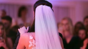 Bride and groom share their first dance together on their wedding day. stock video Bride and groom share their first dance together on their wedding day. stock video
