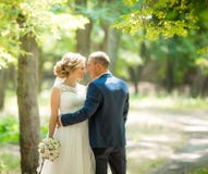 Bride and Groom at wedding Day walking Outdoors on spring nature stock photography Bride and Groom at wedding Day walking Outdoors on spring nature stock photography