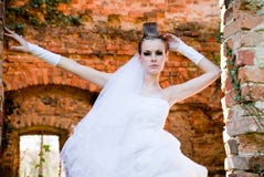Bride by the stone wall