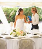 Bride With Wedding Planner In Marquee royalty free stock photo Bride With Wedding Planner In Marquee royalty free stock photo