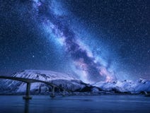 Bridge and starry sky with Milky Way over snow covered mountains royalty free stock image Bridge and starry sky with Milky Way over snow covered mountains royalty free stock image