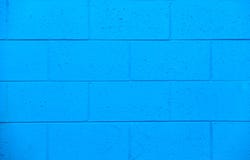 Bright blue exterior brick wall on the side of a building stock images Bright blue exterior brick wall on the side of a building stock images