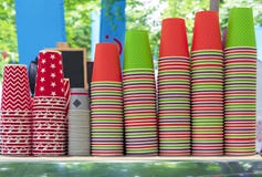 Bright disposable cups on the counter of an outdoor cafe. Paper cups for various drinks royalty free stock photos Bright disposable cups on the counter of an outdoor cafe. Paper cups for various drinks royalty free stock photos