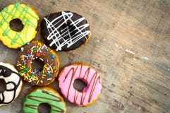 Bright donuts on wooden background royalty free stock image Bright donuts on wooden background royalty free stock image