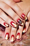 Bright Red And Gold Polish On Nails Stock Photos Bright Red And Gold Polish On Nails Stock Photos