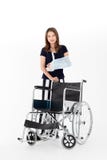 Broken Asian woman with arm sling sponsored in her hands. Wheelchair in front Ideas for accident Injuries and health care Studio stock photo Broken Asian woman with arm sling sponsored in her hands. Wheelchair in front Ideas for accident Injuries and health care Studio stock photo
