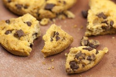 Broken chocolate chip cookies on a tiled worktop Royalty Free Stock Image Broken chocolate chip cookies on a tiled worktop Royalty Free Stock Image
