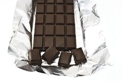 Broken Chocolate On A Foil Royalty Free Stock Photo
