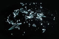Broken glass with sharp Pieces over black in collection